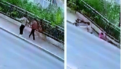 شاهد - رصيف ينشق ويبتلع امرأتين بجانب طريق مزدحم